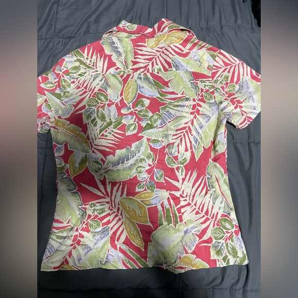 This is a Hawaiian button down shirt. - Picture 3 of 4